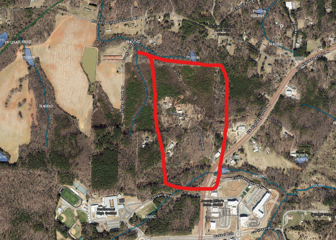 Aerial with the site boundary and mapped wetland features